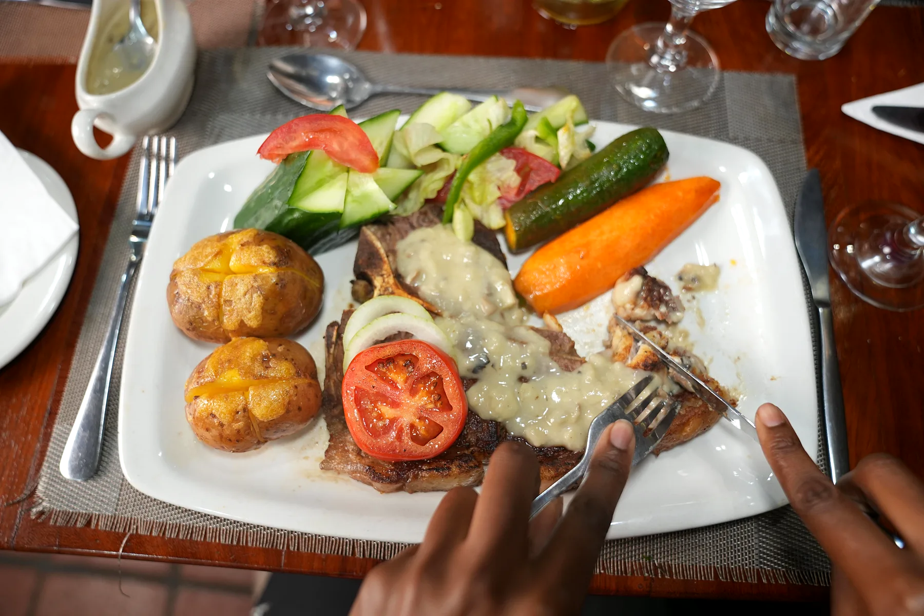 A plated steak at the Baobab Restaurant